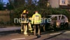 Police & Firefighters by burned car in Acton, London
