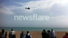 Lancaster Bomber flies over crowds on Folkestone beach