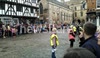 Dot Fraser runs with the Olympic Torch from the Castle to the Cathedral on morning of 28/06/12