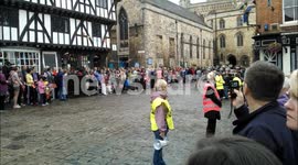 Dot Fraser runs with the Olympic Torch from the Castle to the Cathedral on morning of 28/06/12