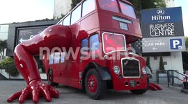 Double Decker Bus doing press ups outside Czech house