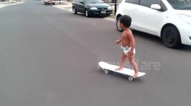 Talented baby rides a skateboard