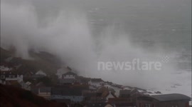 Huge Waves cover cliff and Spectators