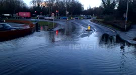 pan across flooded road in Egham