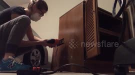 Girl Uses Jigsaw to Cut Hole in Cabinet