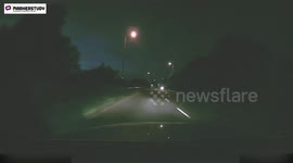 Shocking moment motorcyclist crashes head-on into car