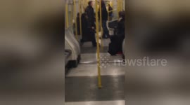 Man appears to shout racist abuse at commuter on the Tube