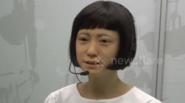 Beautiful female android wows visitors at Robots exhibition