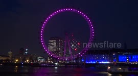 London Eye at night with purple lights