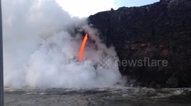 Incredible fire hose of lava flows from Kilauea volcano into the ocean
