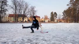 Dog knocks owner off his feet when he tries to slide on ice