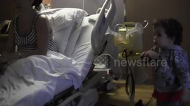 Big brother meets his  baby sister for the first time. His reaction may surprise you.