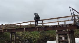 Hiker's cross dangerous bridge in 80 MPH winds! Fimmvörðuháls trail, Iceland