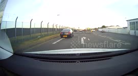 Angry passenger throws bottle of water at motorist's windscreen