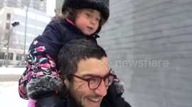 Father walks around Montreal with his daughter after two days of snow