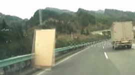 Dashcam films flying planks hit car