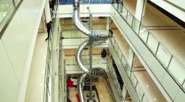 Why wait for the elevator? Shoppers in Chinese mall take slide from fourth floor