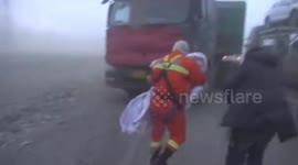 Emergency services rescue stranded motorists during China storm