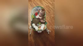 This baby won't let go of his kitten 'best friend'