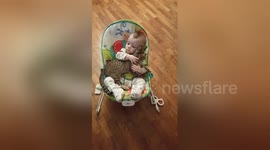 This baby won't let go of his kitten 'best friend'