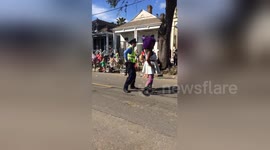 American police officer dances during parade in New Orleans