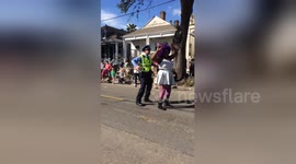 Newsflare Edit - American police officer dances during parade in New Orleans