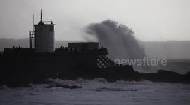 Huge waves hit Porthcawl lighthouse as Storm Charlie lashes UK