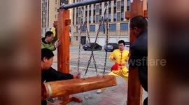 Chinese kung fu masters show off their “balls of steel”