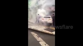 Good samaritans break car window to rescue driver from ablaze car