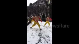 Shaolin Monks filmed practising kung-fu in the snow