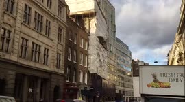 Scaffoliding in great queen street in london gets blown by the heavy wind.