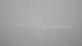 Lorry Driving Through Blowing Snow From Storm Doris