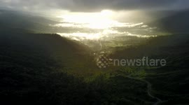 Drone breaking through clouds unveils stunning scenery