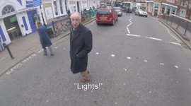 Pedestrian scolds cyclist as for 'running' a green light