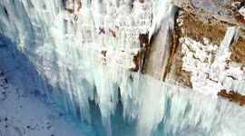 Daredevil climbs massive frozen waterfall in Slovenia