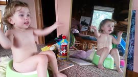 Ridiculously Cute Singing Toddler on the Potty -- Long One