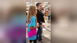Girl reacts emotionally to puppy surprise