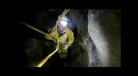 Watch as daredevils navigate through claustrophobia-inducing narrow UK cave