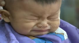 Children get their hair cut for good luck on 'Longtaitou' Festival in China