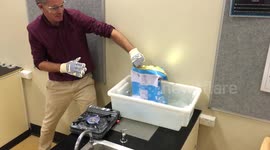 Science teacher uses steam to crush a large metal can