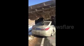 Forklift stops on the top of car after crash in northern China