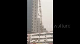 Crane collapses during storm killing two in China