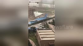 Building roof torn by strong winds in eastern China