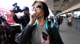 Actress Jane Fonda is'nt interested in answering stupid paparazzi questions as she arrives at LAX Airport in Los Angeles, Ca