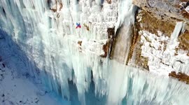 Daredevil climbs massive frozen waterfall in Slovenia
