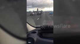 Cyclist in the middle of 5-lane motorway