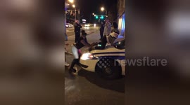 Girl twerks on police car in New York