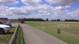 Dramatic moment a replica Spitfire lands without undercarriage