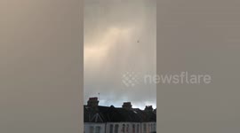 SWNS Video - A bolt of lightning struck a plane on its descent into Heathrow airport last night