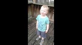 Toddler experiences PURE JOY standing in the rain!